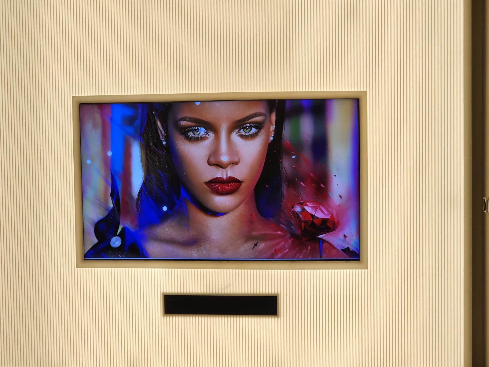 Flush-mounted TV set into a panelled wall